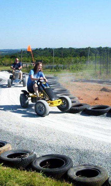 Racing pedal karts around the track at Maize Quest Fun Park - Maple Lawn Farms (York County, PA)